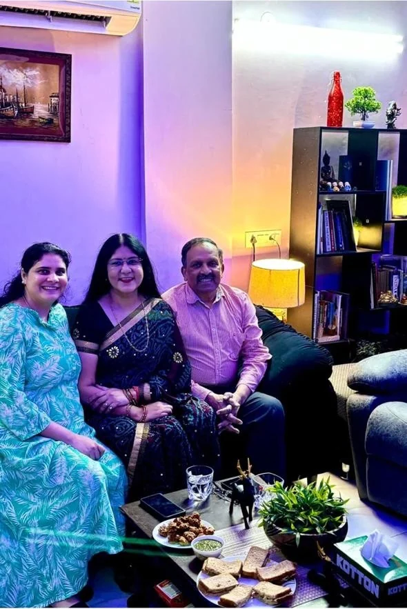 Anjali Saxena and her husband Rahul seated in the living room during the prize visit