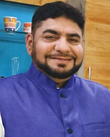 Chef Dr Izzat Husain in a purple bandhgala